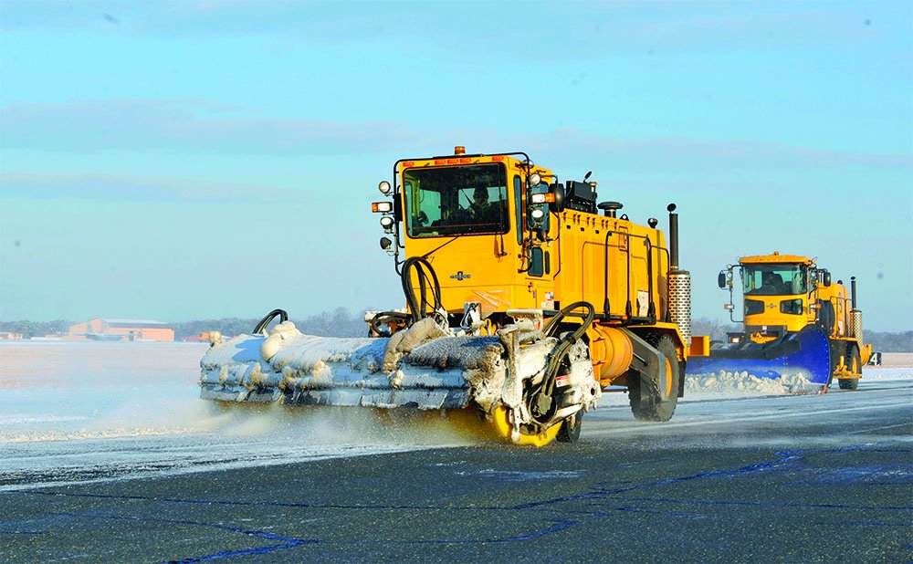 snow plows on runway